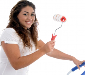girl holding roller brush
